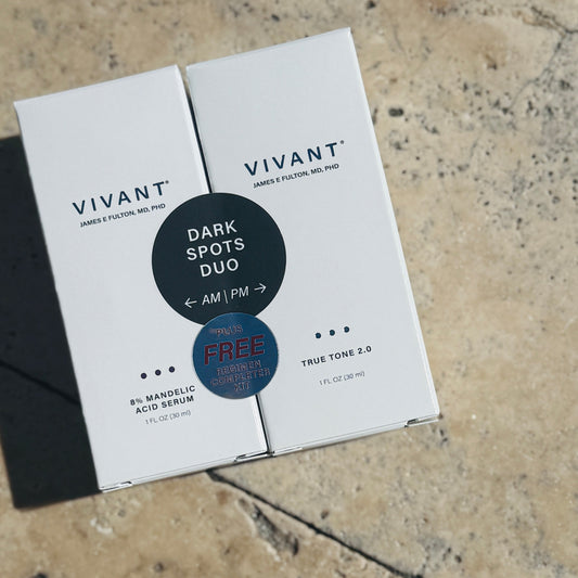 Vivant skincare product packaging on a textured stone surface